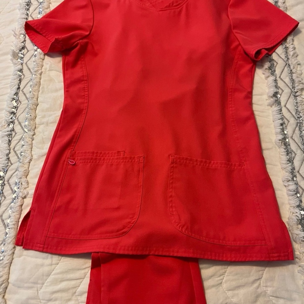 5 sets of scrub Top & Pants Sets and 2 scrub tops. Worn only a couple of times